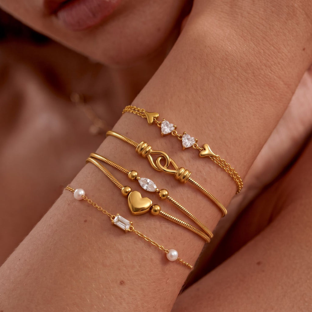 Gold Layered Dainty Bracelet – Heart, Sun, Knot & Pearl Zirconia