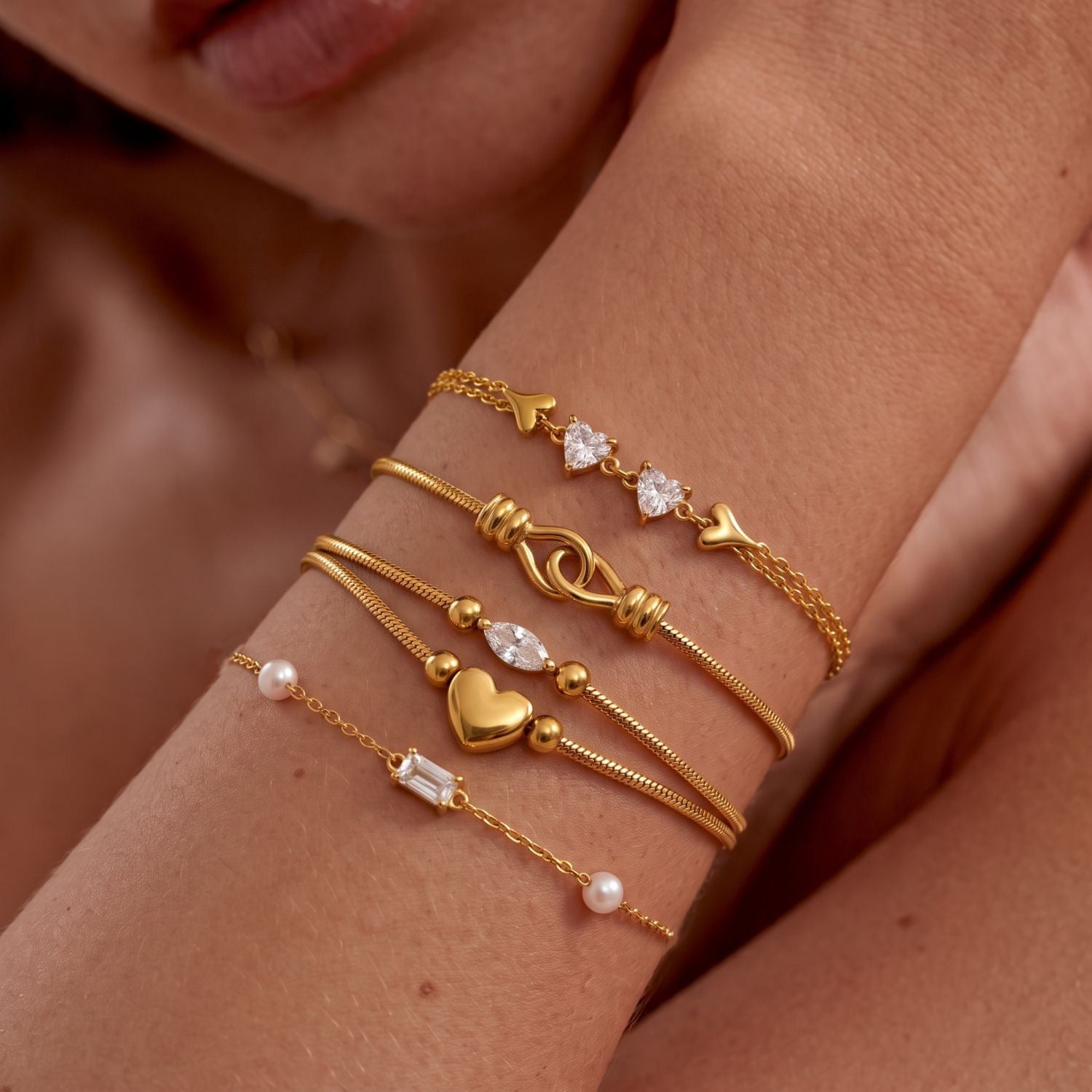 Gold Layered Dainty Bracelet – Heart, Sun, Knot & Pearl Zirconia