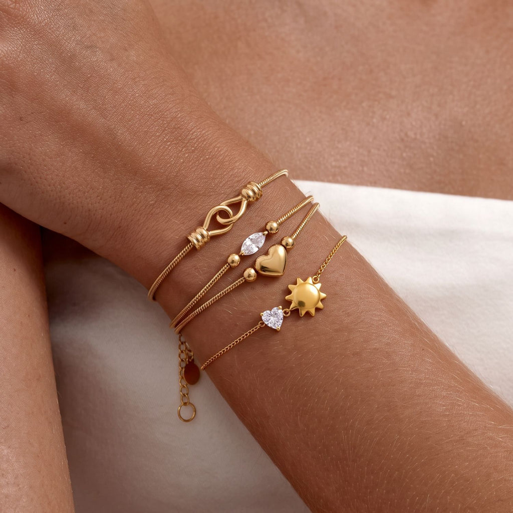 Gold Layered Dainty Bracelet – Heart, Sun, Knot & Pearl Zirconia