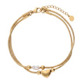 Gold Layered Dainty Bracelet – Heart, Sun, Knot & Pearl Zirconia