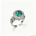 Emerald Green Moissanite Roman Fountain-Inspired Ring with Rotating Tassels & Iris Motif - UMI